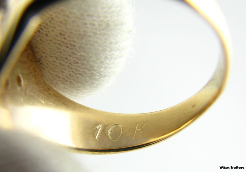 This ring weighs 5.8 grams . The face measures 19/32 (14.7mm) tall 