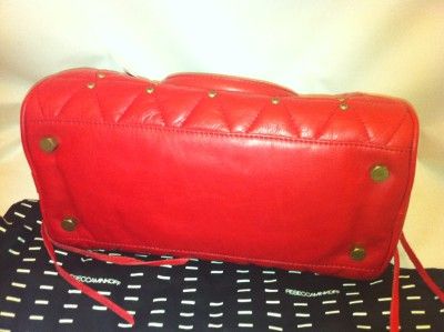  is red leather studded with gold colored studs, inside is black 