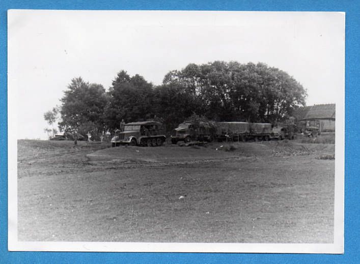 WW2 German Half Track & Truck Column Outside Village  